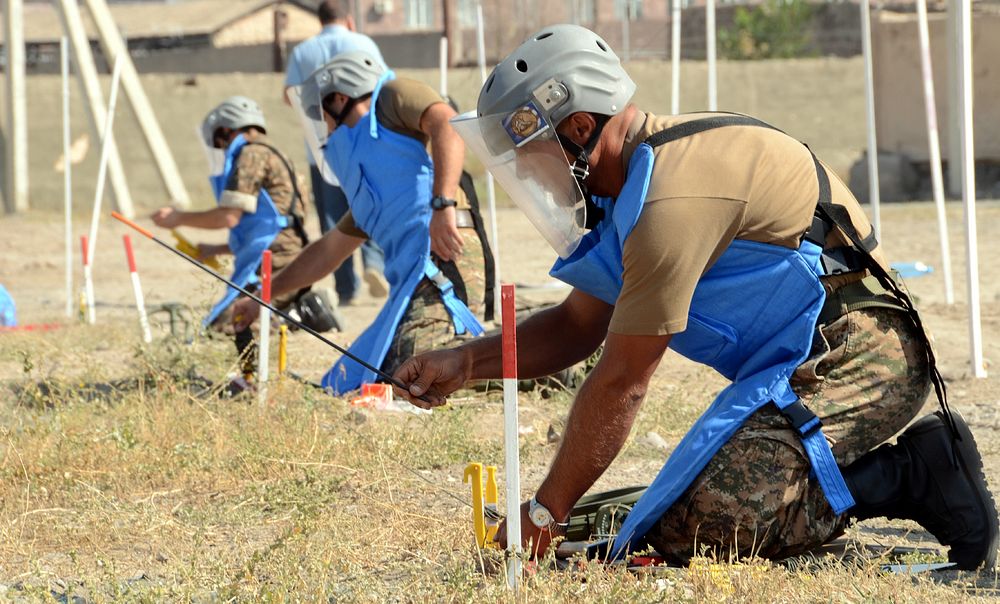 Armenian Peacekeeping Brigade soldiers conduct a simulated one-man demining drill as part of a training course in Yerevan…