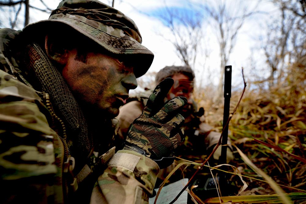 U.S. Air Force Tech. Sgt. Bobby Colliton and Staff Sgt. Dane Hatley conduct combat survival training near Osan Air Base…