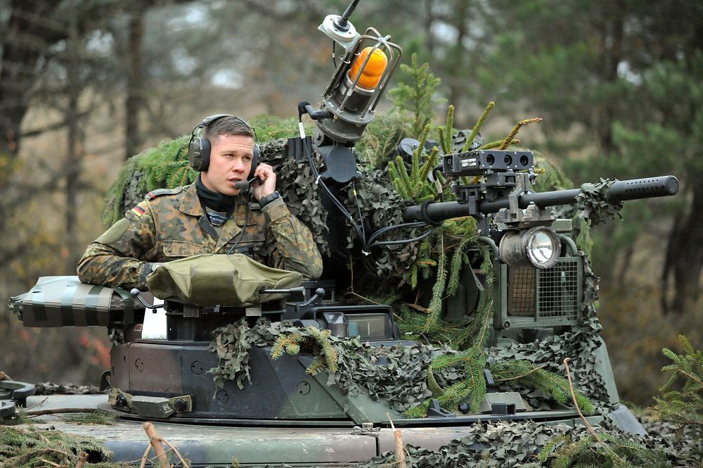 A German soldier in a Marder infantry fighting vehicle scans the battlefield during Saber Junction 2012 at the Joint…
