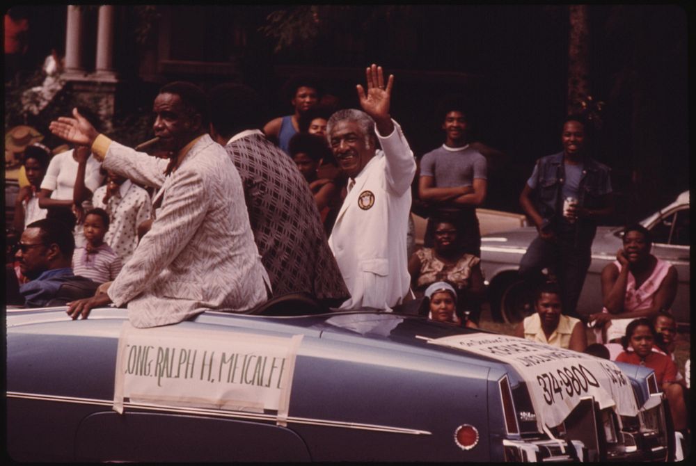 Illinois Congressman Ralph H. Metcalfe (White Coat) Greeting Constituents During The Bud Billiken Day Parade, 08/1973.…