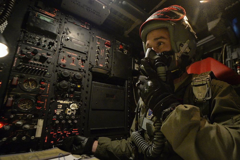U.S. Air Force Capt. Greg Lepper, a navigator with the 96th Bomb Squadron, checks instruments in a B-52 Stratofortress…