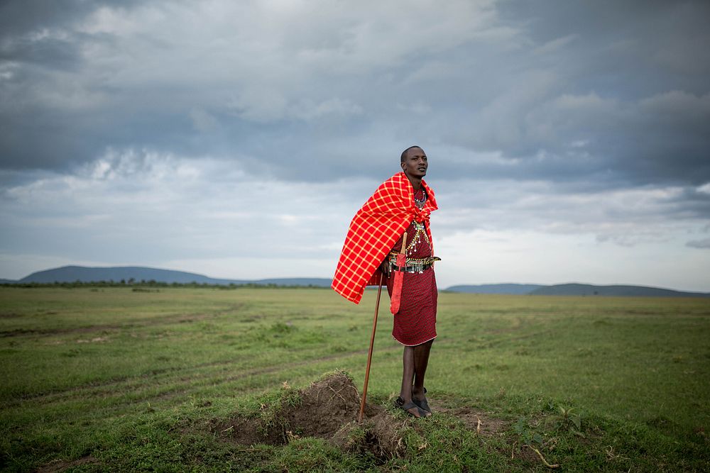 Josphat Mako, Maasai guide and companion to author and travel writer Stuart Butler stands in the Mara North Conservancy…