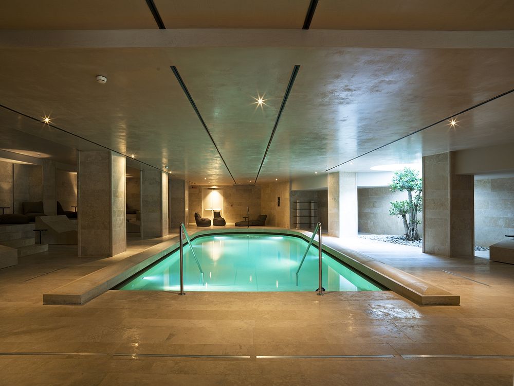 Indoor swimming pool at A.Roma Lifestyle Hotel