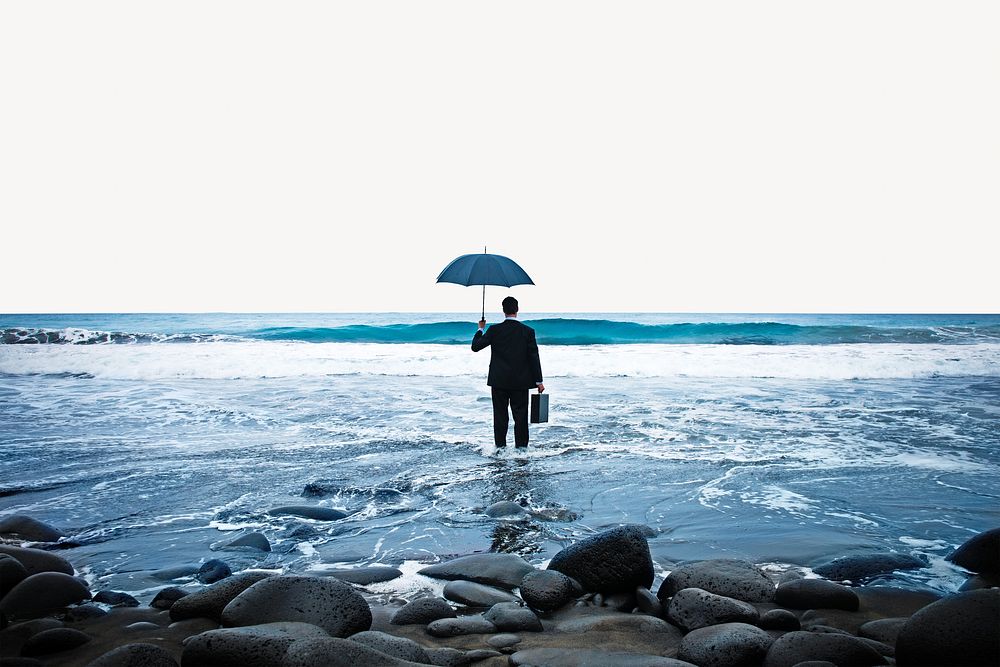 Businessman standing with an umbrella in the ocean image element 