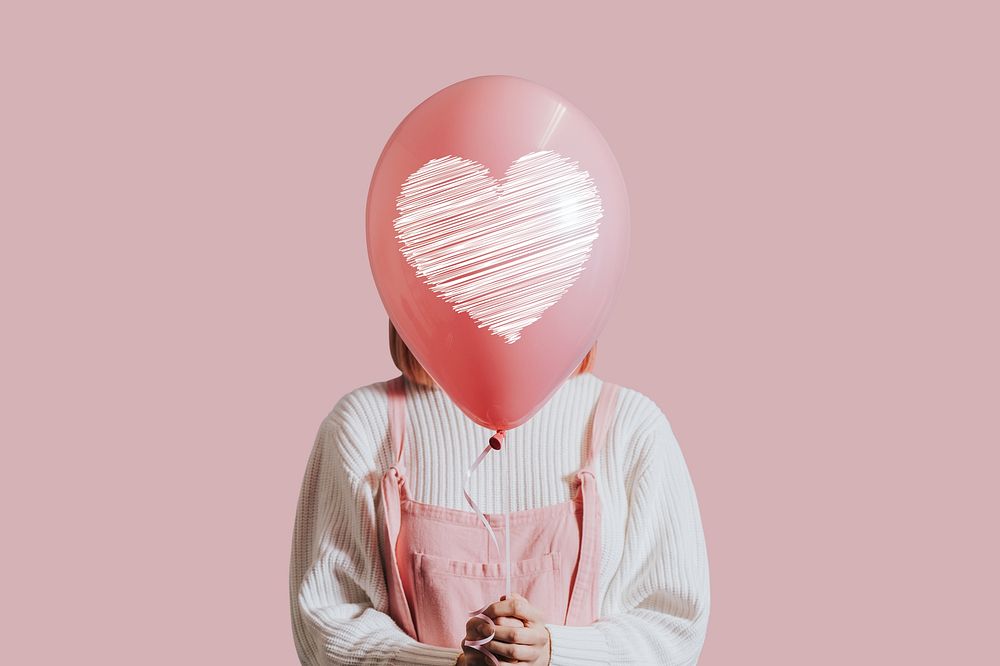 Pink aesthetic love background, woman holding balloon