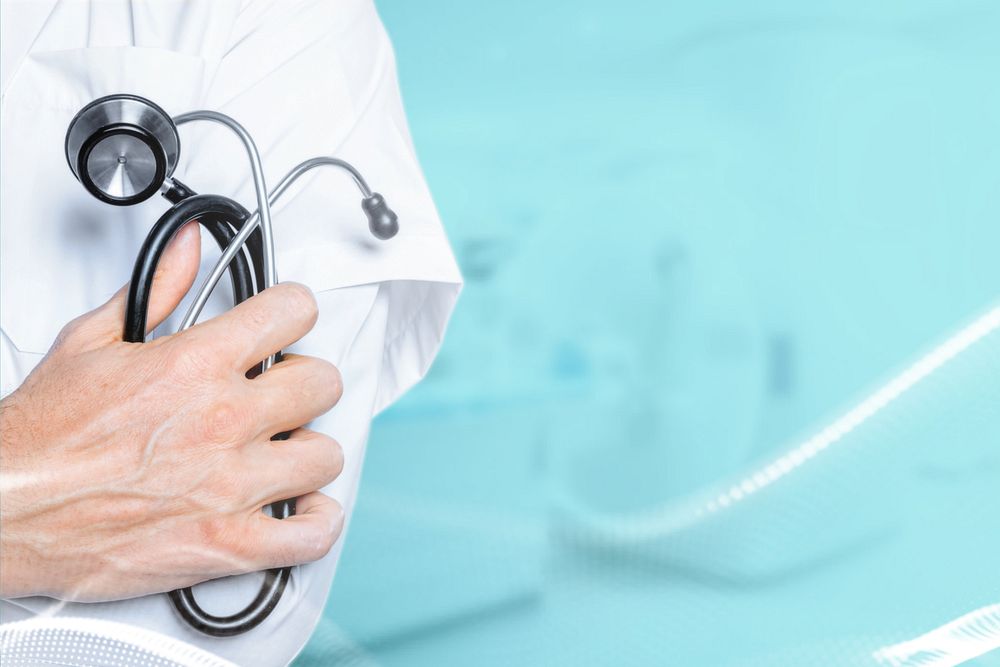 Doctor holding stethoscope, health & wellness