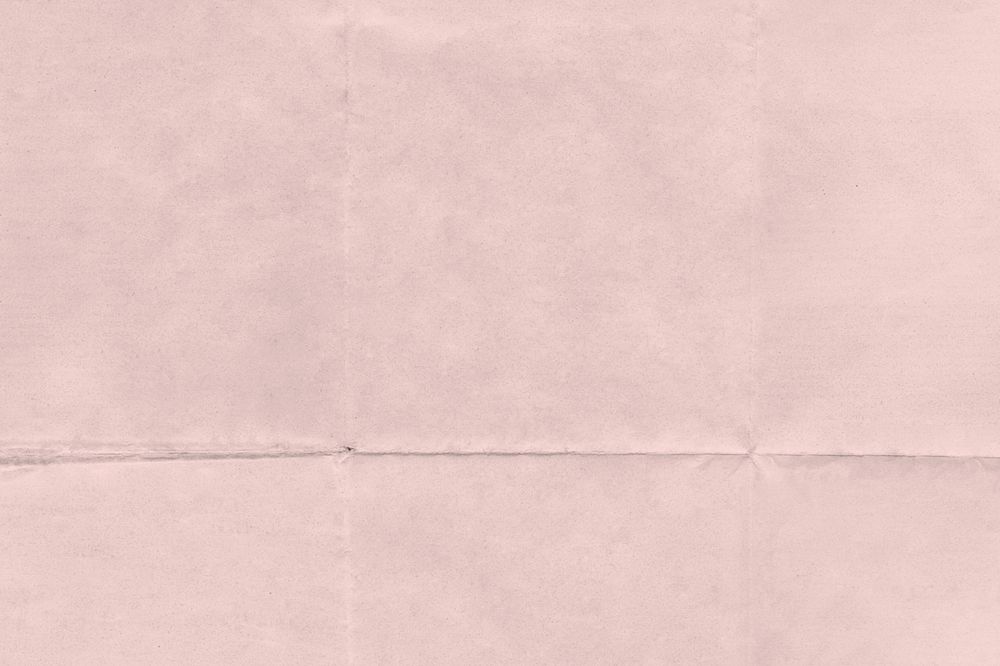 Pink wrinkled paper background, folded textured design