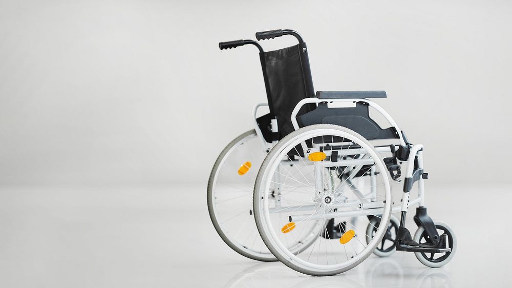Empty wheelchair, hospital image with copy space