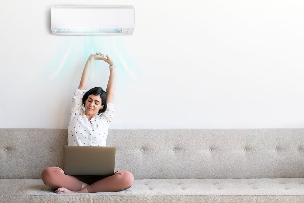 Woman with air conditioner image with copy space
