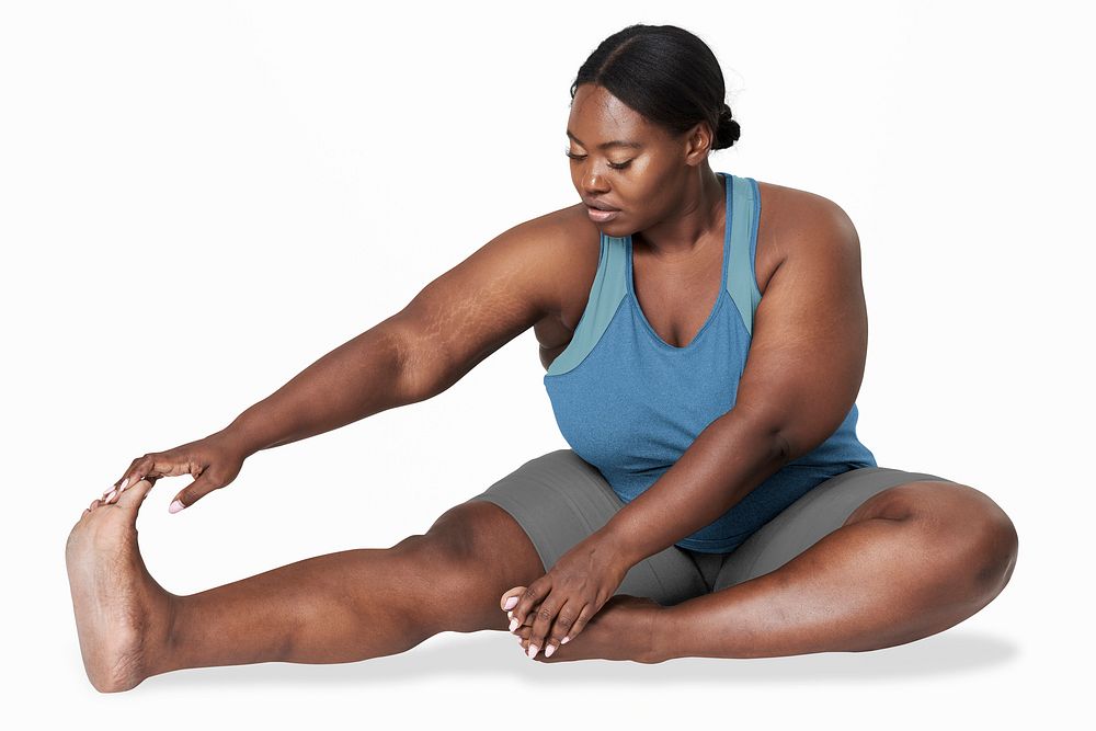 Plus-size woman stretching her leg