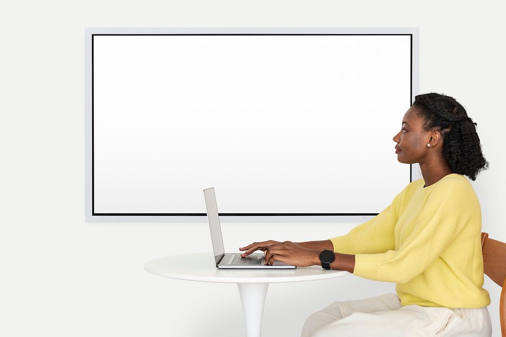 Blank projecting screen mockup psd with college student working on laptop