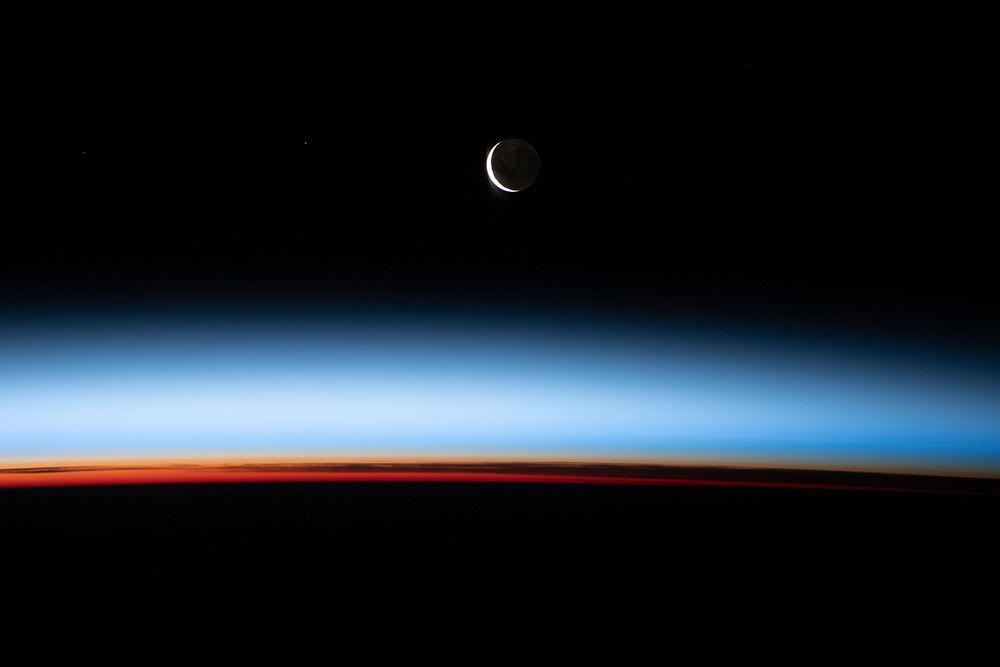 A waxing crescent Moon is pictured from the station iss066e086969 (Dec. 6, 2021) --- A waxing crescent Moon during is…
