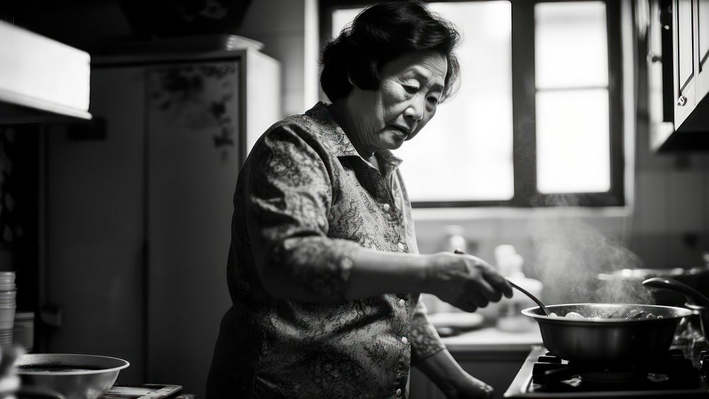 A photo of chinese aunt cooking. AI generated Image by rawpixel. 