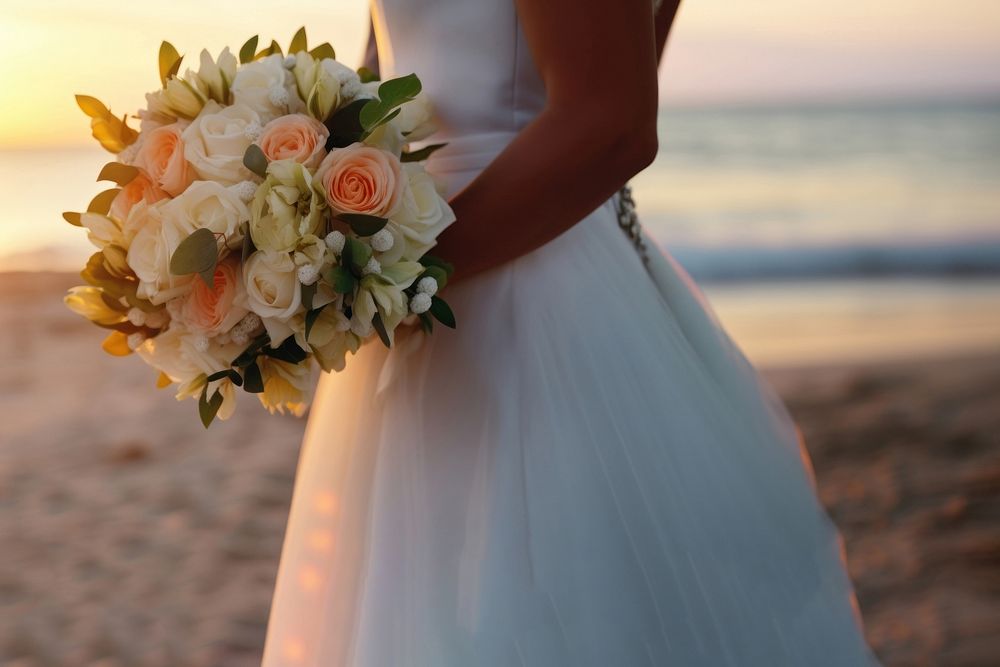 Closeup groom and bride have bouquet at the sunset beach, focus on bouquet. AI generated Image by rawpixel. 