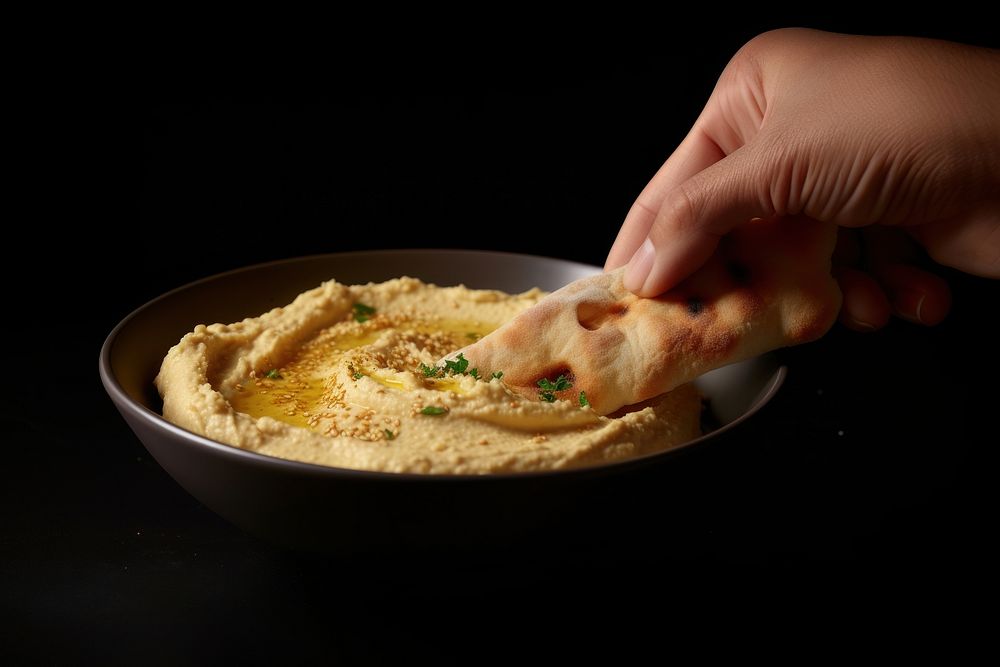 Freshly Made Hummus Ready Serve Free Photo Rawpixel   CHJpdmF0ZS9sci9pbWFnZXMvd2Vic2l0ZS8yMDIzLTEwL21vdGFybzdfY2xvc2VfdXBfaGFuZF9zaG90X29mX2FfcGVyc29uX2lzX2RpcHBpbmdfYnJlYWRfaW5faHVtbV8xMjYyZmMwZS1kMGEwLTQzYWEtOTY0MS1jZThlOTNiODdkOTMuanBn 