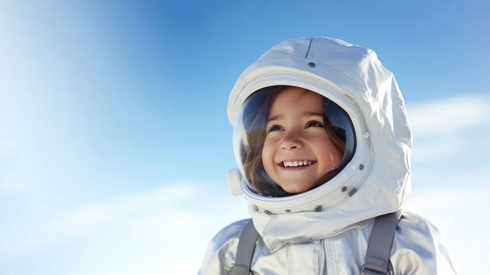 a photo of smiling girl child dressed as astronaut.  