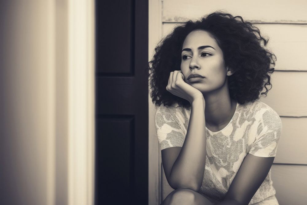 Authentic photo of mixed race woman is sitting and contemplating something. AI generated Image by rawpixel. 