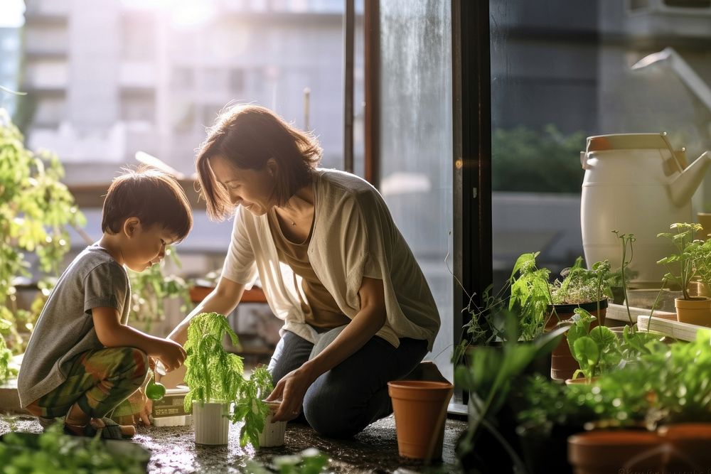 photo a Mother and son watering vegetables in their urban garden.  