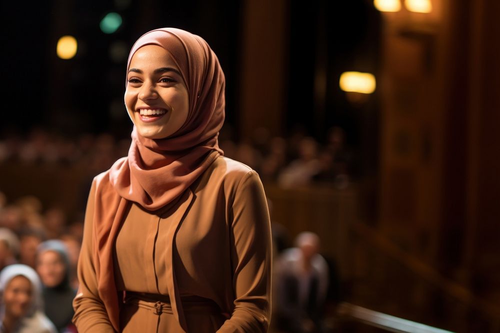 Young Muslim woman speaker on professional stage. AI generated Image by rawpixel. 