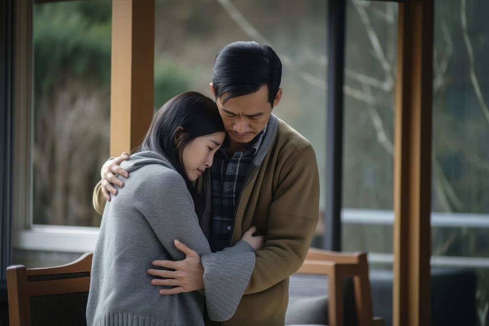 Asia young people stress hugging adult woman. 