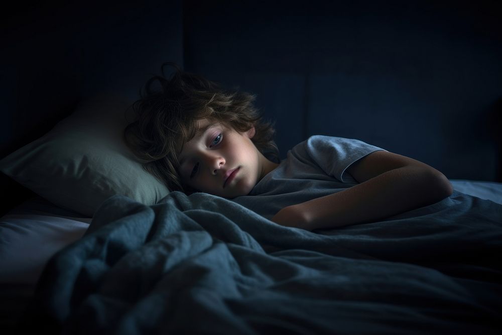 Depressed treenage kid blanket bed contemplation. AI generated Image by rawpixel.