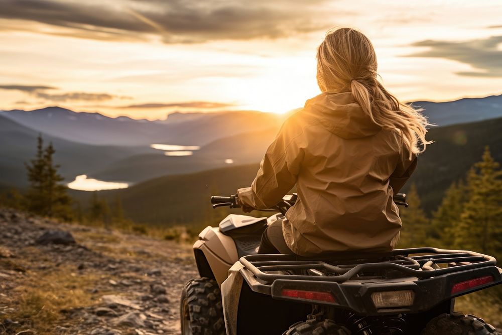 Woman riding ATV mountain outdoors vacation. AI generated Image by rawpixel.