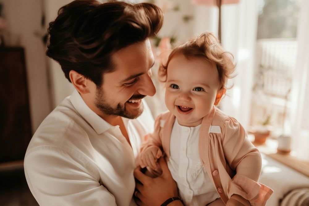 Man holding adorable baby smiling adult happy. AI generated Image by rawpixel.