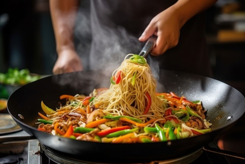 Chef make stir fry chow mein noodles food vegetable cooking. AI generated Image by rawpixel.