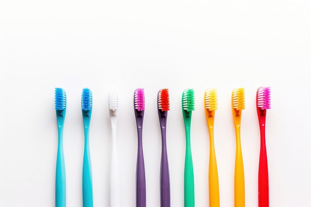 Colorful toothbrushes white background copy space variation. 