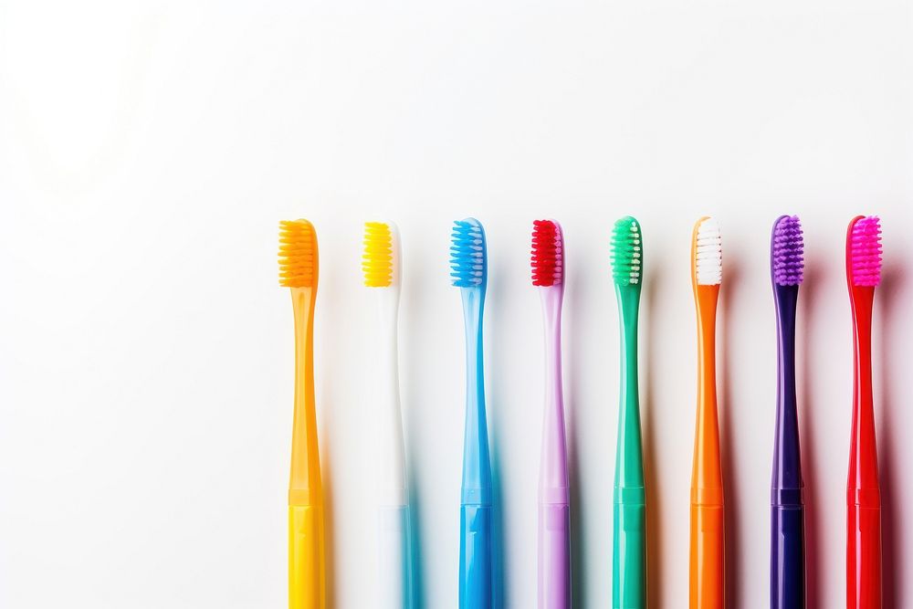 Colorful toothbrushes white background copy space variation. 