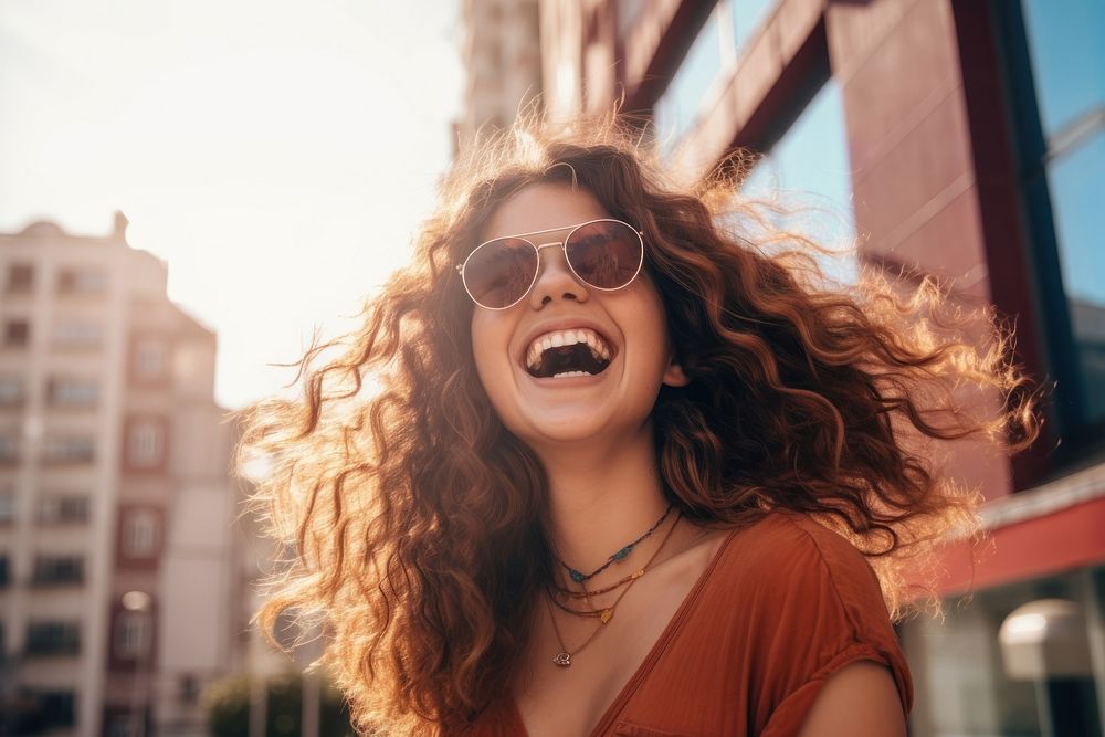 Woman having fun laughing outdoors glasses. 