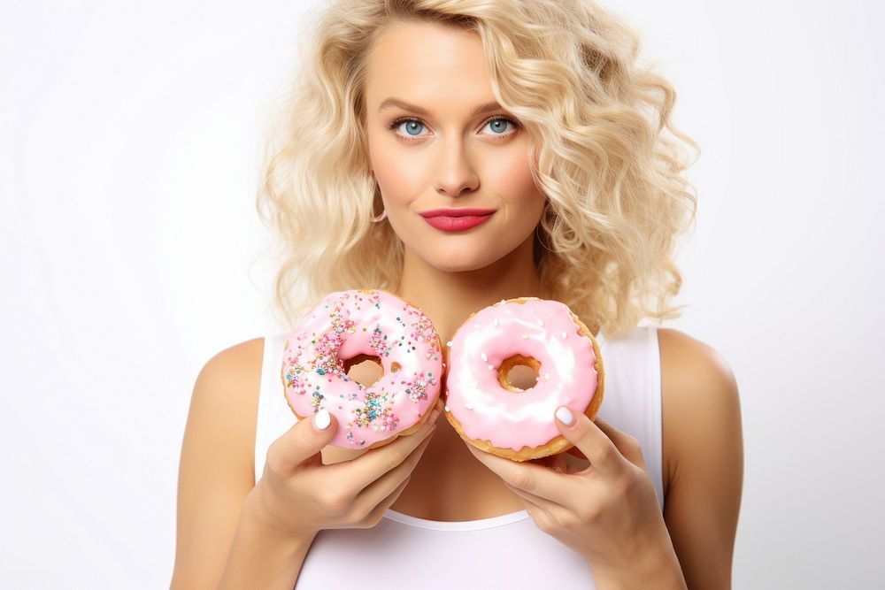A woman eating donuts adult food white background. AI generated Image by rawpixel.