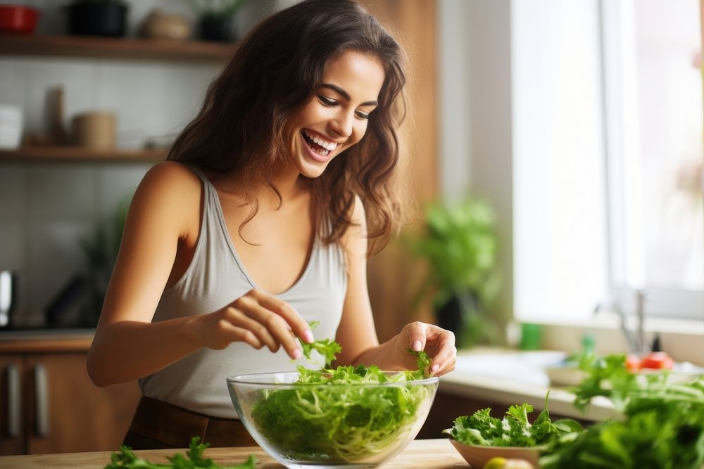 Woman mixing bowl salad adult happy. 