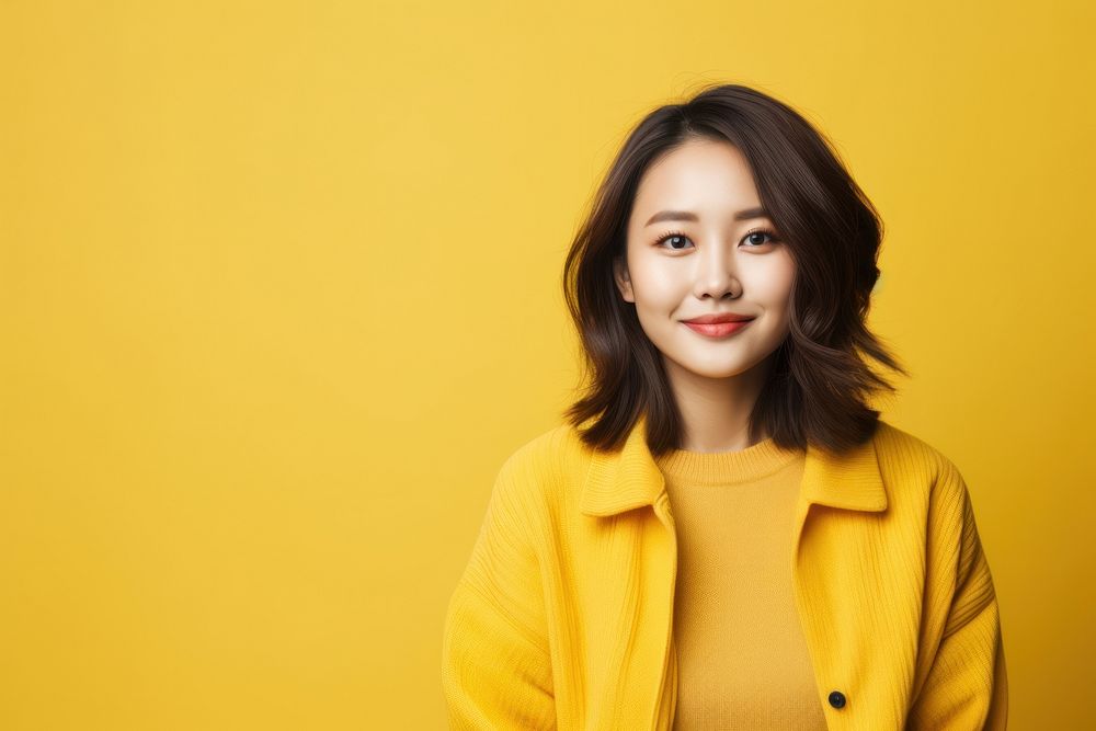 Young asian woman portrait smiling yellow. AI generated Image by rawpixel.