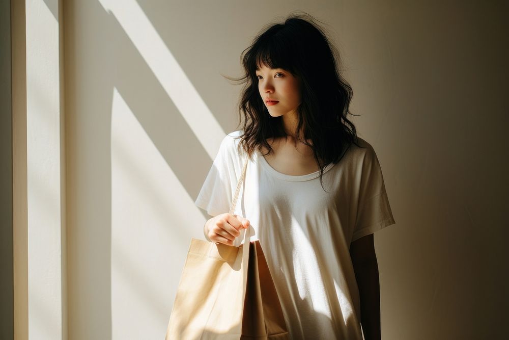 Woman holding shopping bag handbag fashion adult. AI generated Image by rawpixel.