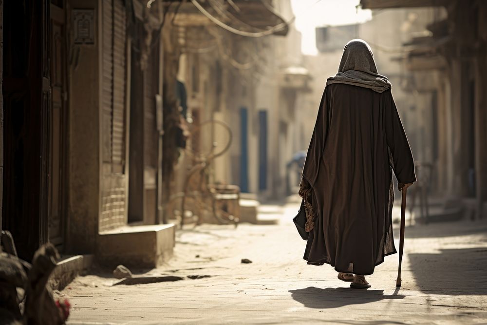 Middle eastern old woman walking street adult. AI generated Image by rawpixel.
