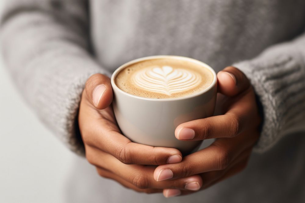 Mug cappuccino holding coffee. AI generated Image by rawpixel.