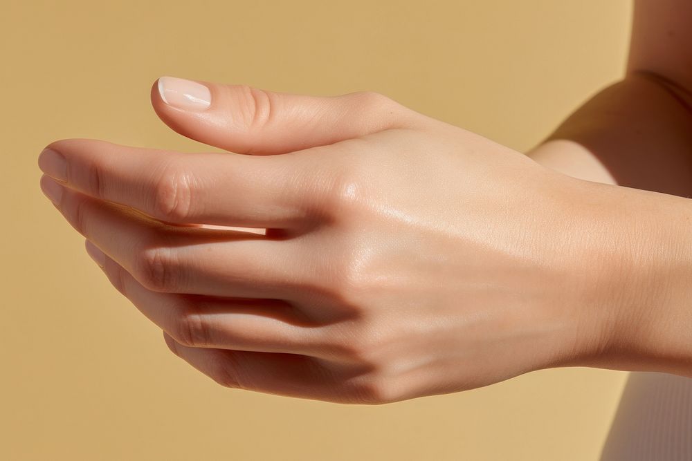 Woman applying cream hand finger skin. 