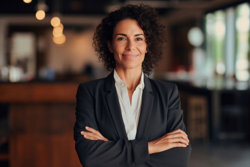 Middle aged hispanic manager woman smiling arms crossed adult smile entrepreneur. AI generated Image by rawpixel.