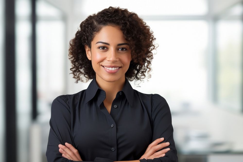 Smiling hispanic office-woman arms crossed adult smile hairstyle. AI generated Image by rawpixel.