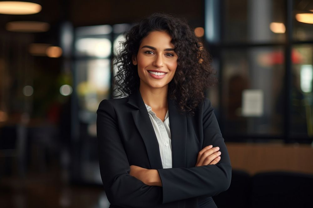 Smiling hispanis business woman arms | Free Photo - rawpixel