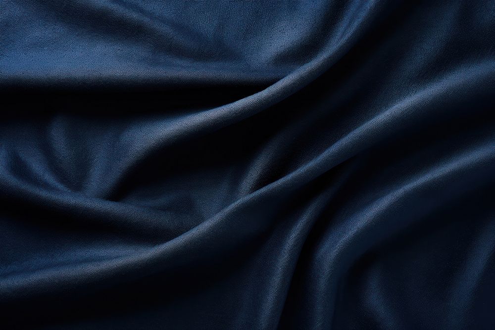 Dark blue fabric texture backgrounds crumpled wrinkled. 