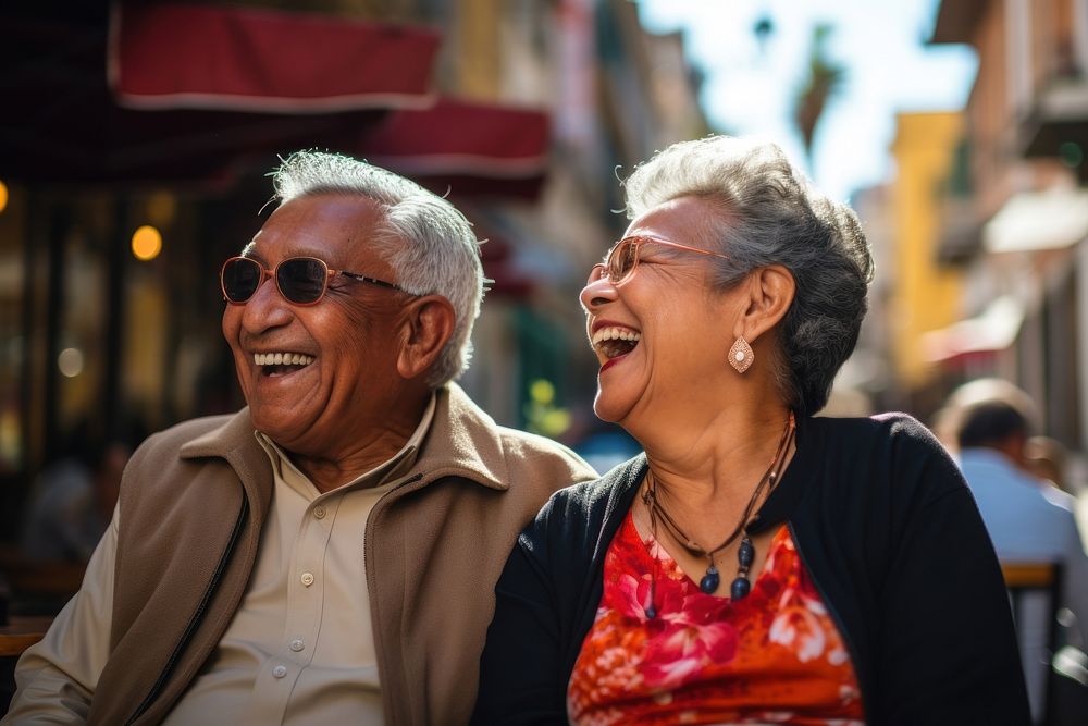 Elderly Hispanic couple retirement laughing portrait. 