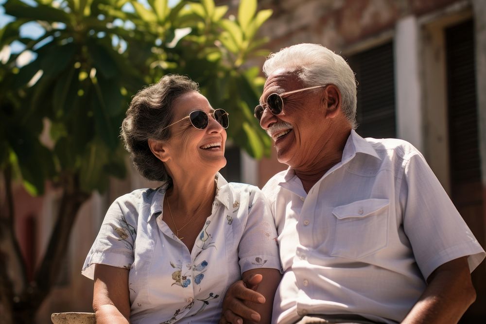 Elderly Hispanic couple retirement outdoors glasses. 