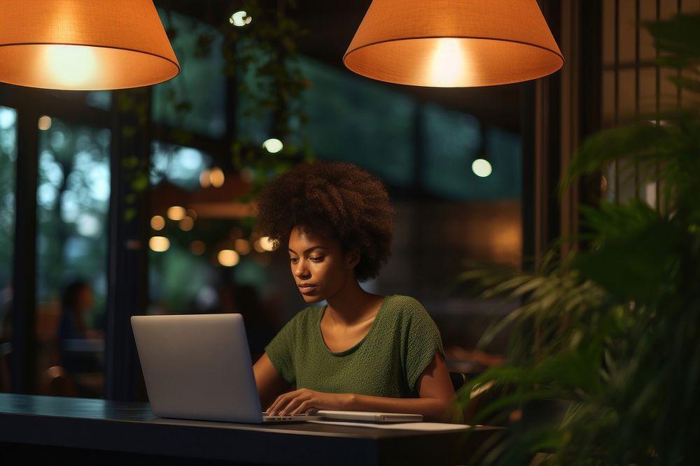 Black Young woman working laptop computer table. 