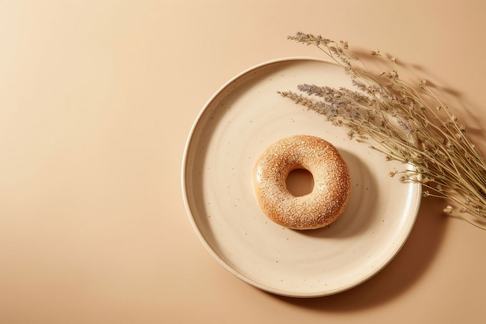 Plate bagel food confectionery. AI generated Image by rawpixel.