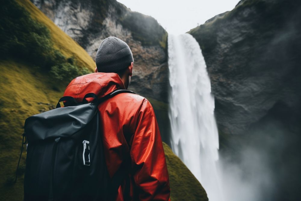 Backpack waterfall outdoors looking. AI generated Image by rawpixel.