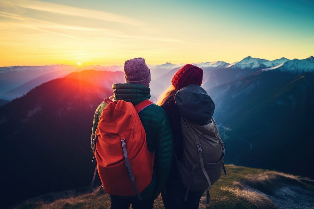 Happy couple backpacker backpacking mountain sunset. 