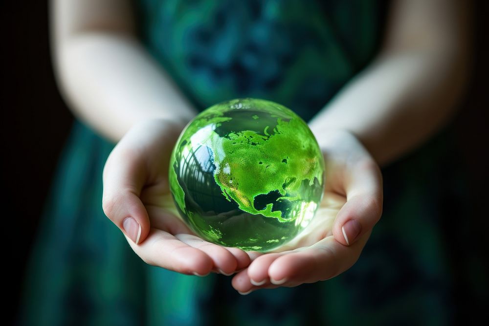 Girl holding a green fluid earth sphere planet globe. AI generated Image by rawpixel.