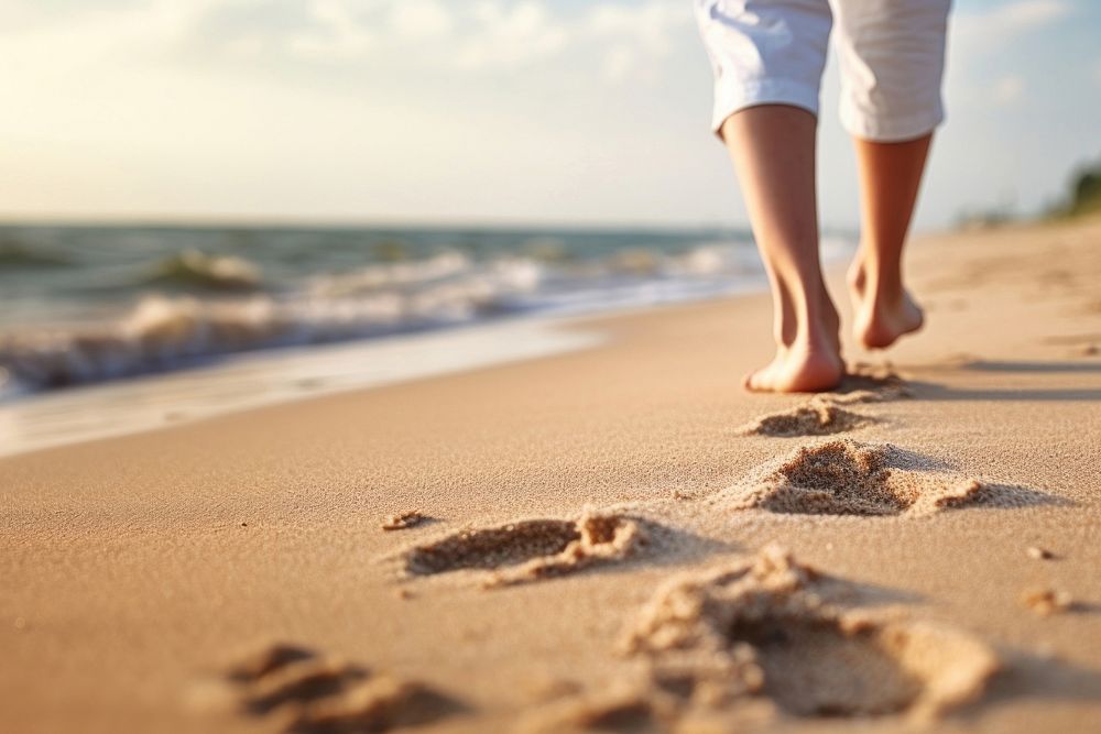 Human footsprint on sand beach in summer,. 